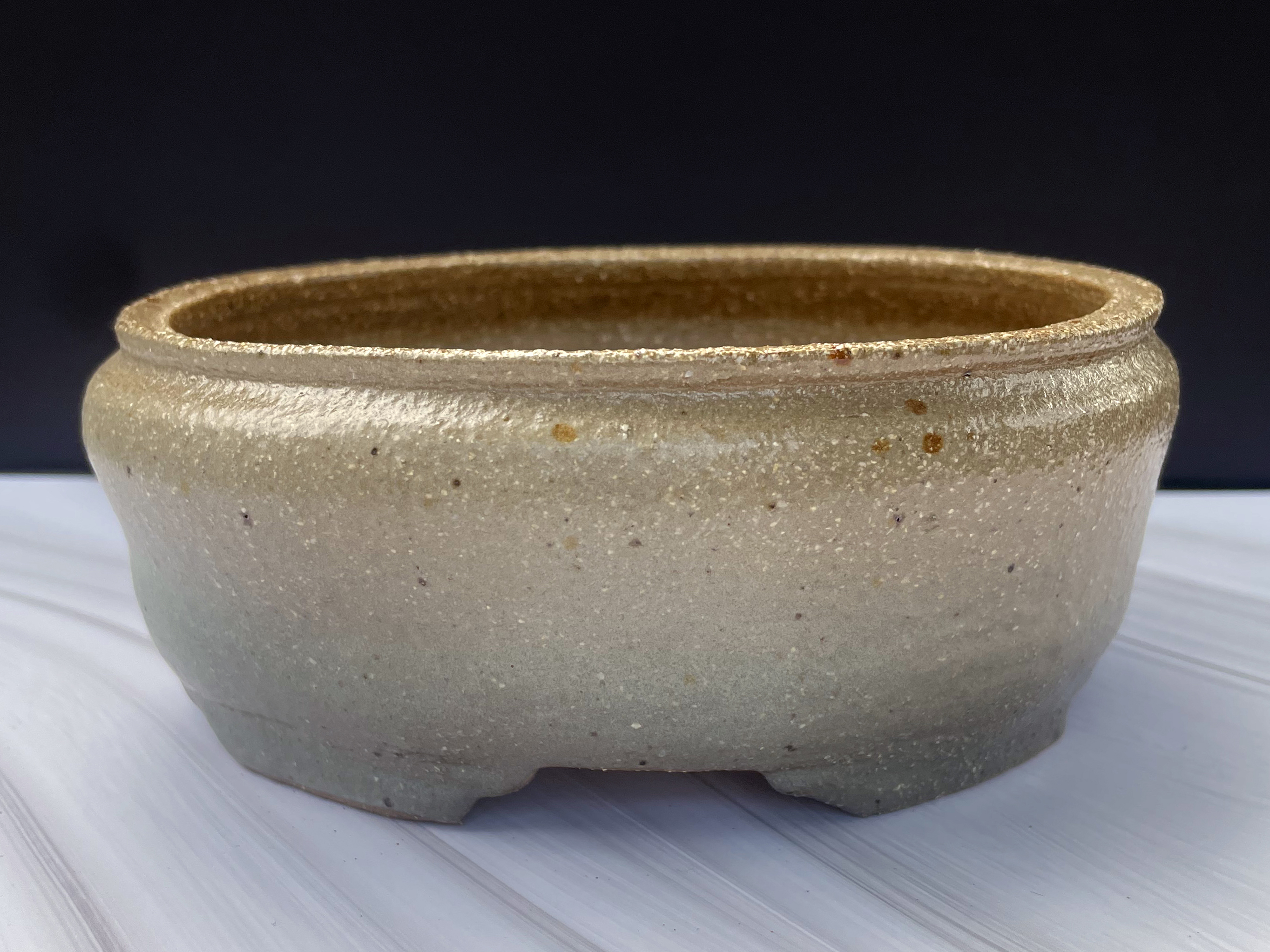 small tan and gray oval bonsai pot